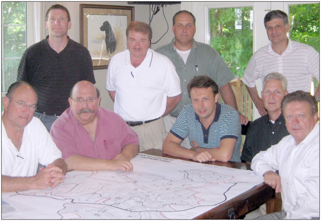LOOKING BACK-County mayor Dale Reagan (standing center in white) gathered with developers and contractors to go over plans for the LaGardena Resort project back in 2010 just before it was scheduled to break ground.  Real estate broker Dino Cates (sitting, second from right), who recently commented on the failed development in the Herald Citizen newspaper, said the project “fell through due to the economy.” (HORIZON file photo)