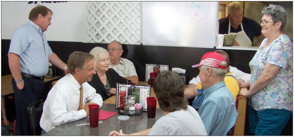 TALKING WITH THE FOLKS-Tennessee Governor Bill Haslam (near left, seated) and Senator Mae Beavers (center left, seated) join in conversation with some Clay County citizens at Doris’s Diner during their recent visit to Celina. Clay County Mayor Dale Reagan (standing left) looks on.