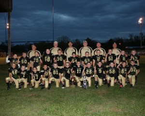 CHAMPION JUNIOR DAWGS-The Junior Bulldog’s defeated Watertown 27-6 to finish with a perfect season and a conference title, as did the other two Clay County Youth Football teams. Pictured are (front row) Michael Mullin #46, Keaton Roberts #7, Jackson Pedigo #17, Michael Smith #28, Kyler Westmoreland #81, Joseph Birdwell #4, Nate Adams #11, Lance Burchett #26, Reece Adams #9, Jimmie Strong #58, Seth Richards #67, and Braiden Jones #32; (standing) Ben Mayfield #50, Nate Mayberry #60, Cole Herrera #75, Wyatt Browning #68, Cole Rich #30, Jared Smith #54, Austin Anderson #65, Hayden McGee #2, Noah Groce #51, Hayden Adams #9, Brayden Allred #33. The team is coached by Randall Walker, Jason Browning, Jeff Rich, Willie Allred, head coach Matt Adams, and Mike Adams. (photo submitted)